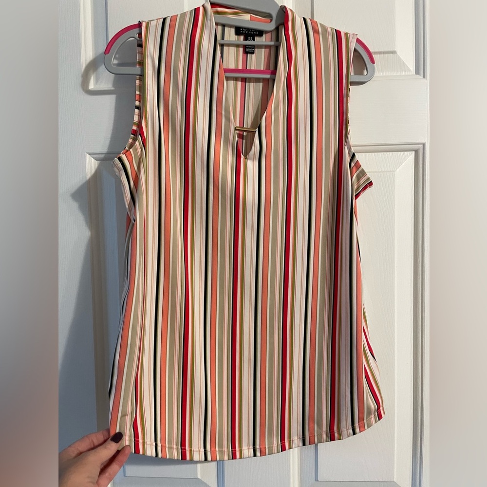 Medium weight blouse. I’m a size 6 and 5’4”.